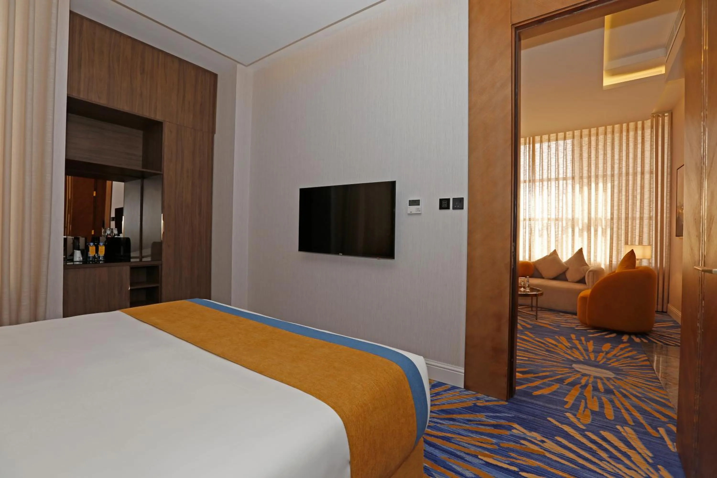 Communal lounge/ TV room, Bed in Novo Hotel