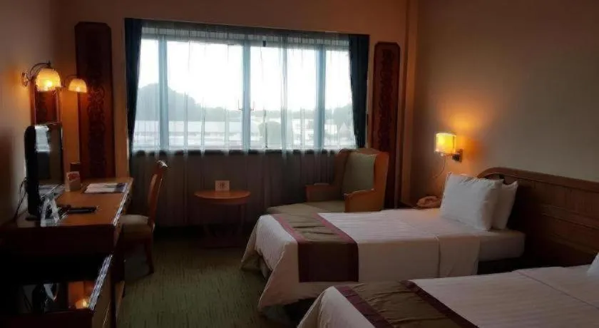 Bed in The CentrePoint Hotel