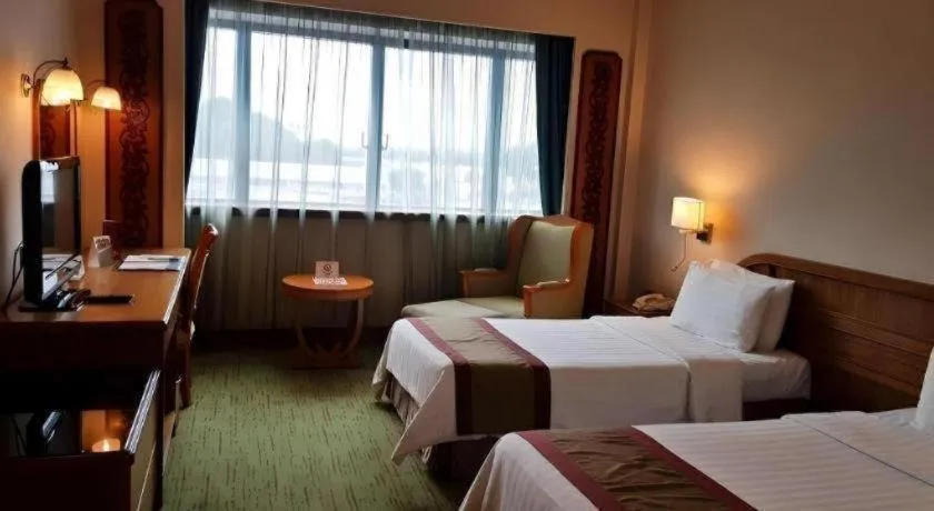 Bed in The CentrePoint Hotel