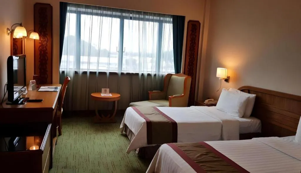 Bed in The CentrePoint Hotel