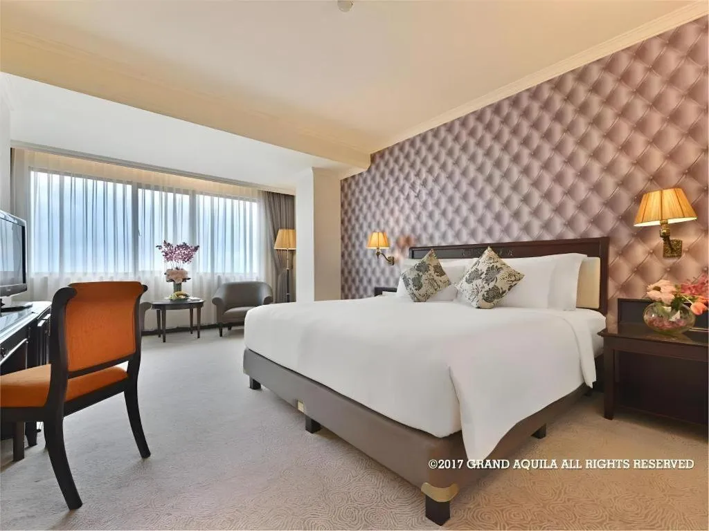 Bed in Grand Aquila Hotel