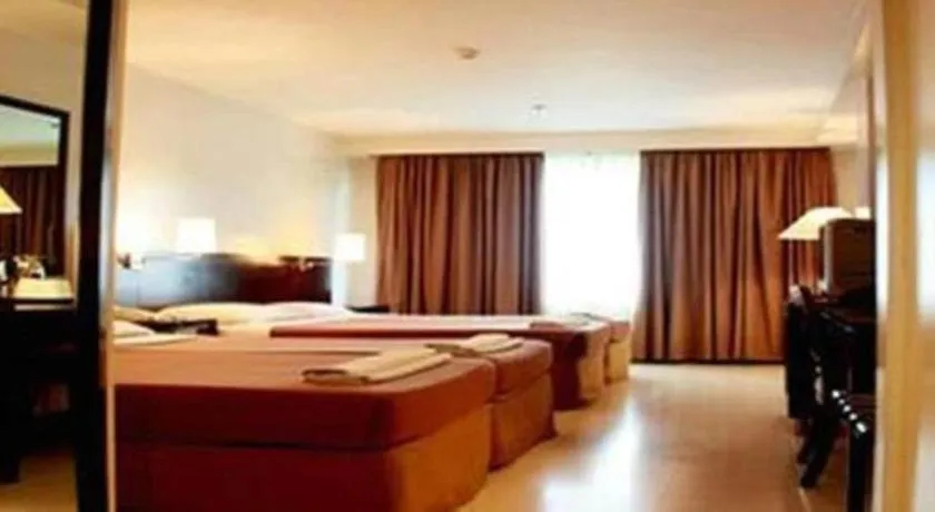 Bed in Hotel Supreme Convention Plaza