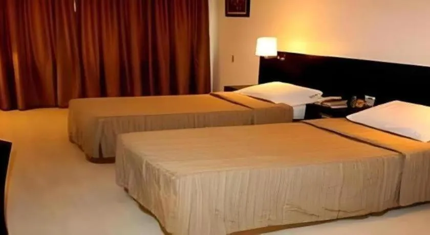 Bed in Hotel Supreme Convention Plaza