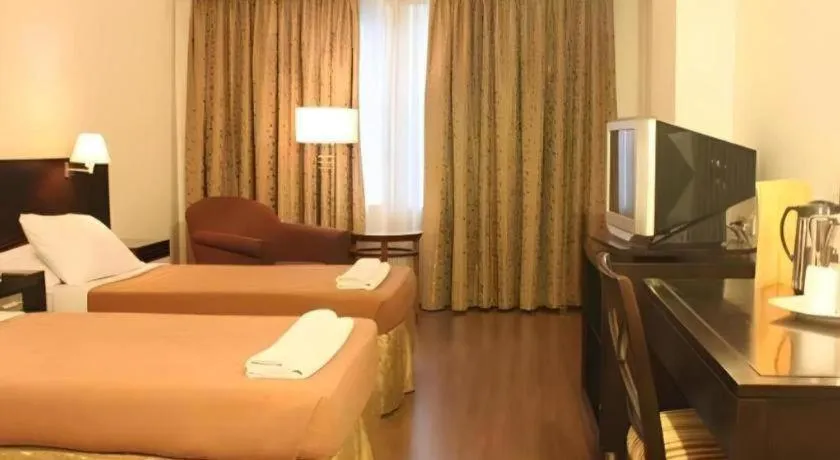 Bed in Hotel Supreme Convention Plaza