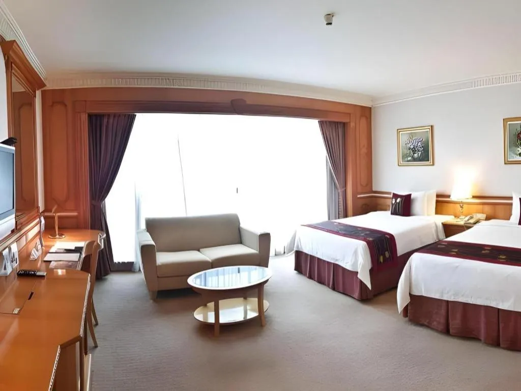 Bed in The Rizqun International Hotel