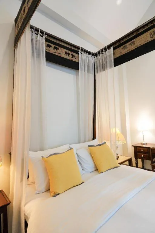 Bed in Baan Klang Wiang Hotel