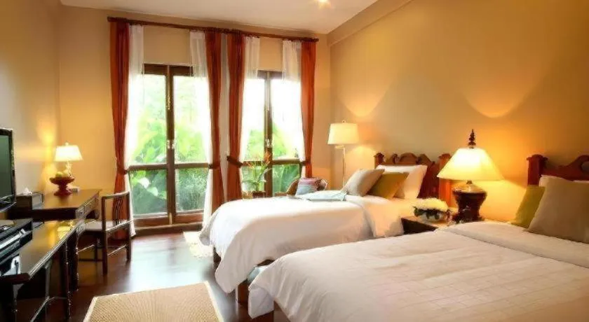 Bed in Baan Klang Wiang Hotel