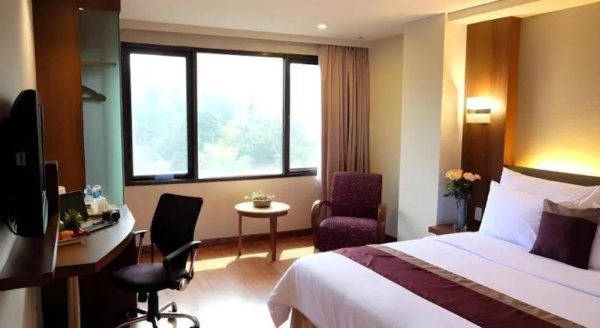 Bed in Grand Cemara Hotel