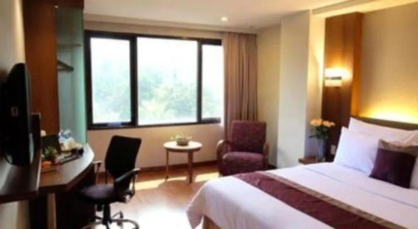 Bed in Grand Cemara Hotel