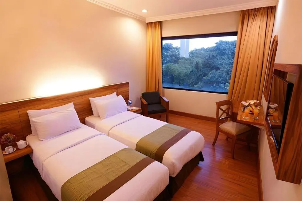 Bed in Grand Cemara Hotel