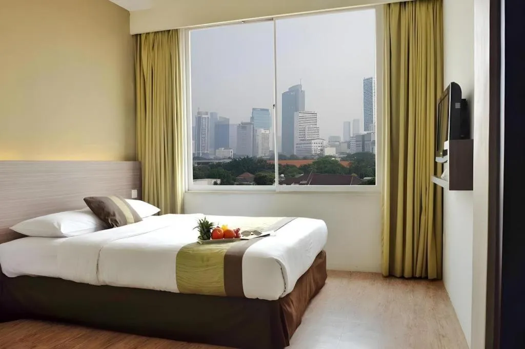 Bed in Grand Cemara Hotel