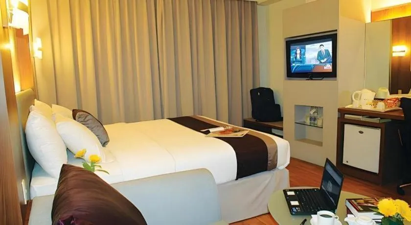 Bed in Grand Cemara Hotel