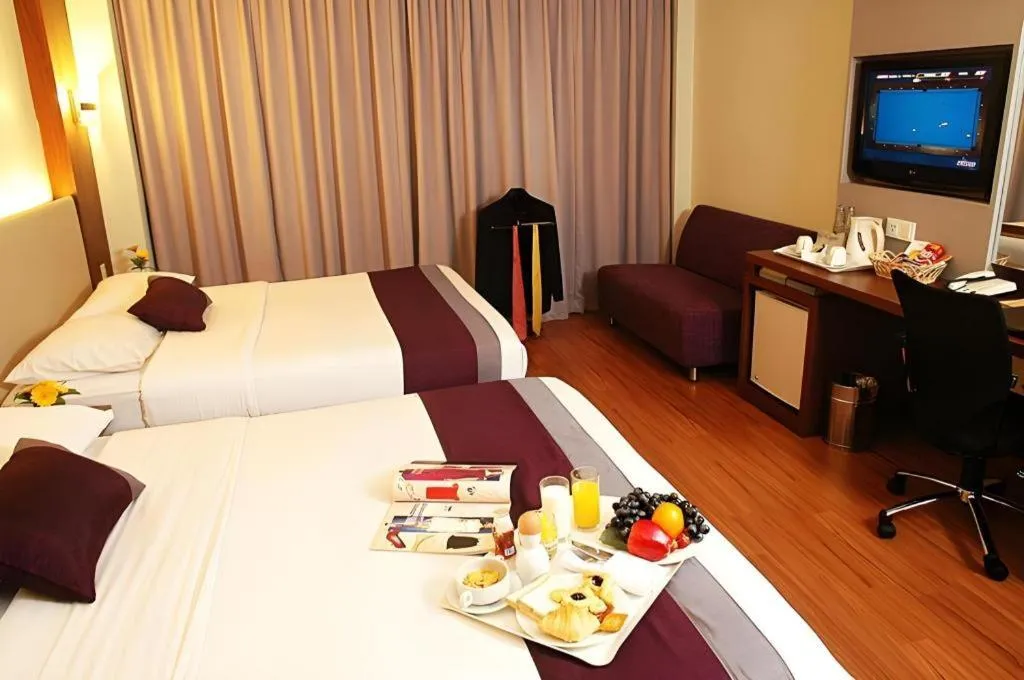 Bed in Grand Cemara Hotel