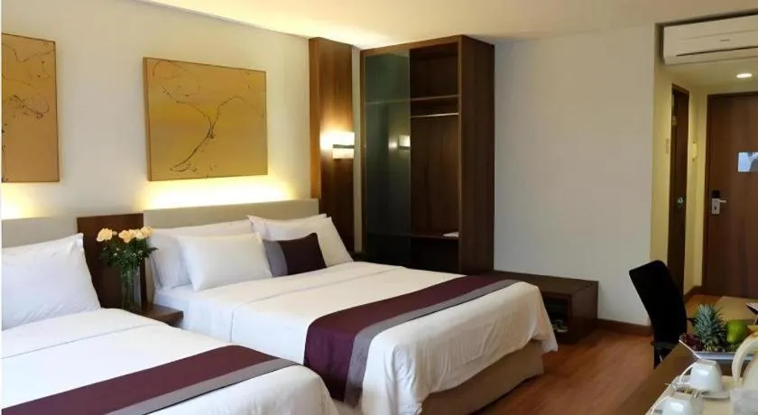 Bed in Grand Cemara Hotel