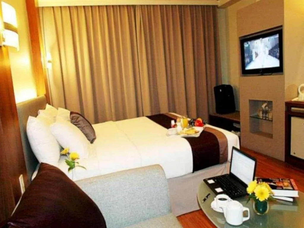 Bed in Grand Cemara Hotel