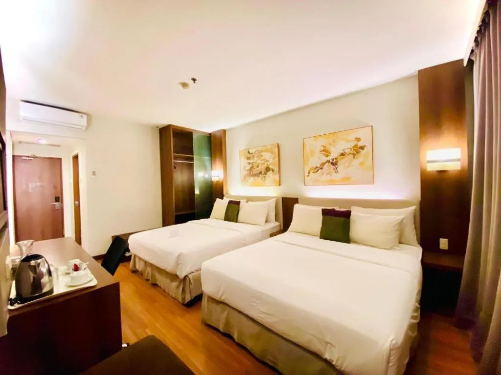 Bed in Grand Cemara Hotel