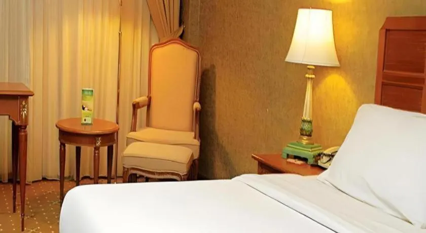 Bed in Grand Cemara Hotel