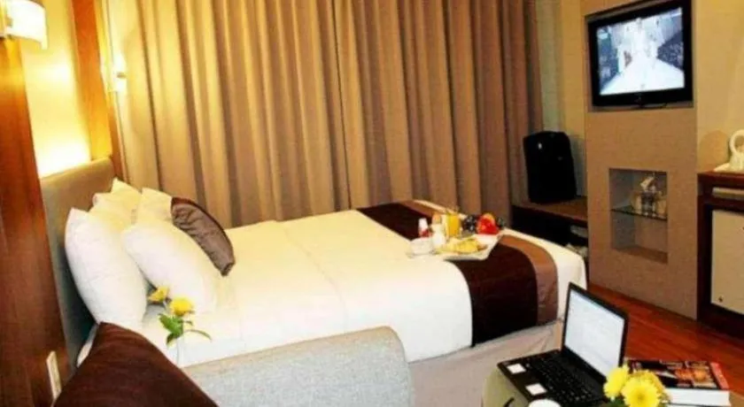 Bed in Grand Cemara Hotel