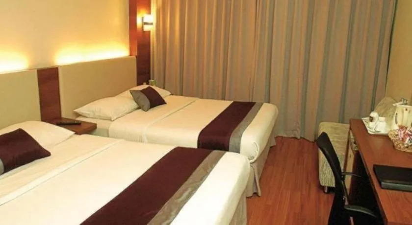 Bed in Grand Cemara Hotel