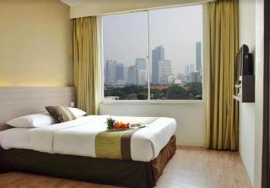 Bed in Grand Cemara Hotel