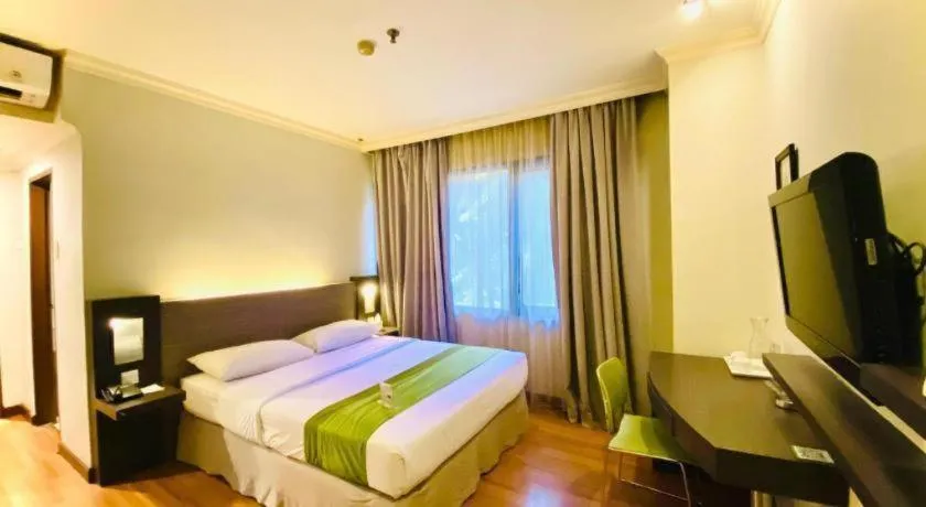 Bed in Grand Cemara Hotel