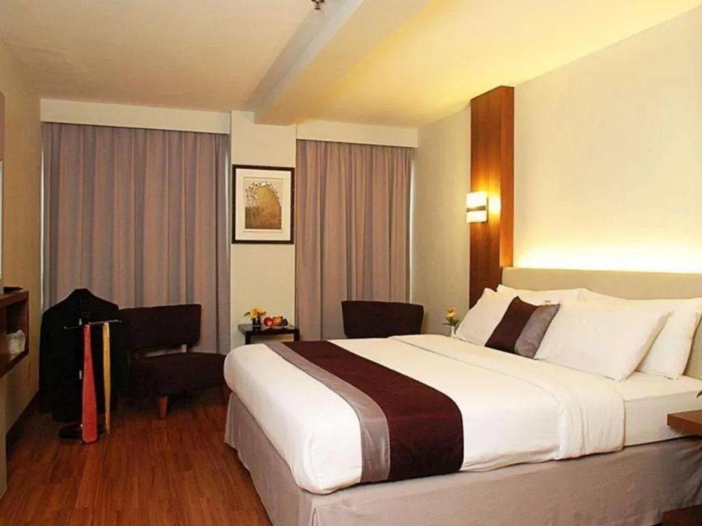 Bed in Grand Cemara Hotel
