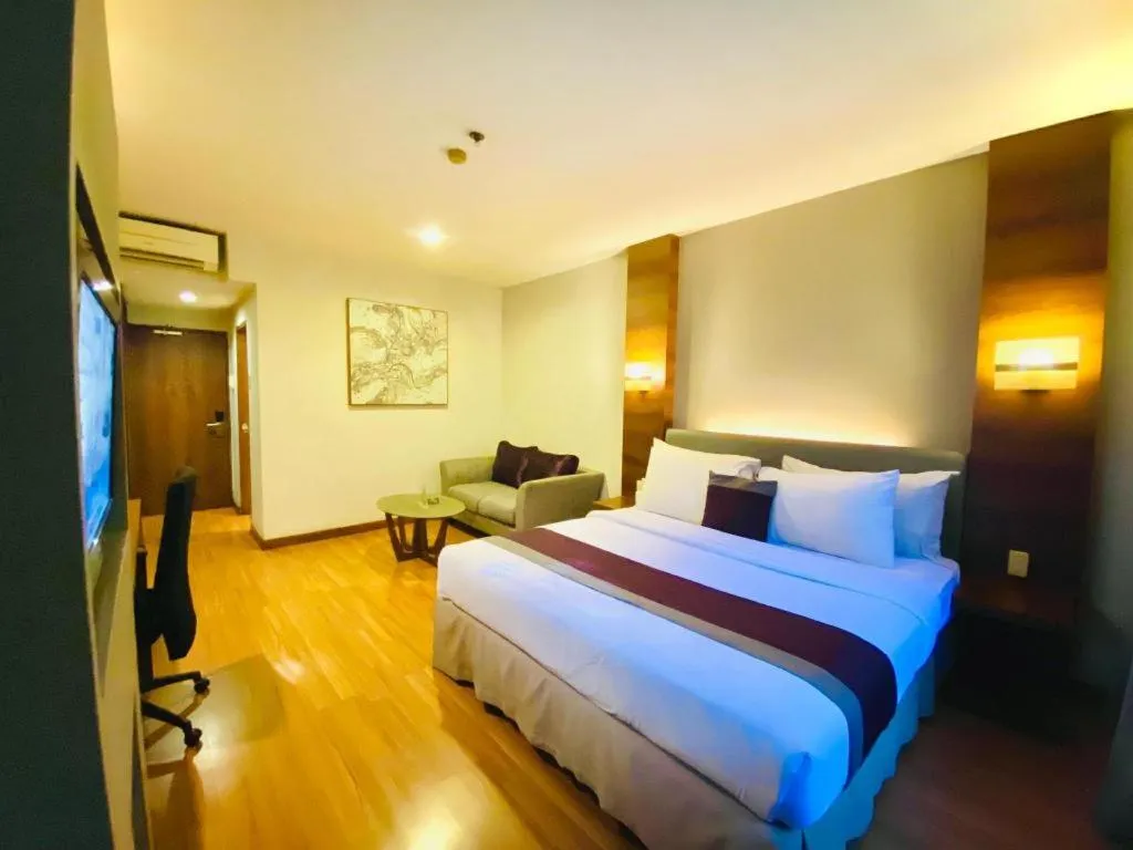 Bed in Grand Cemara Hotel