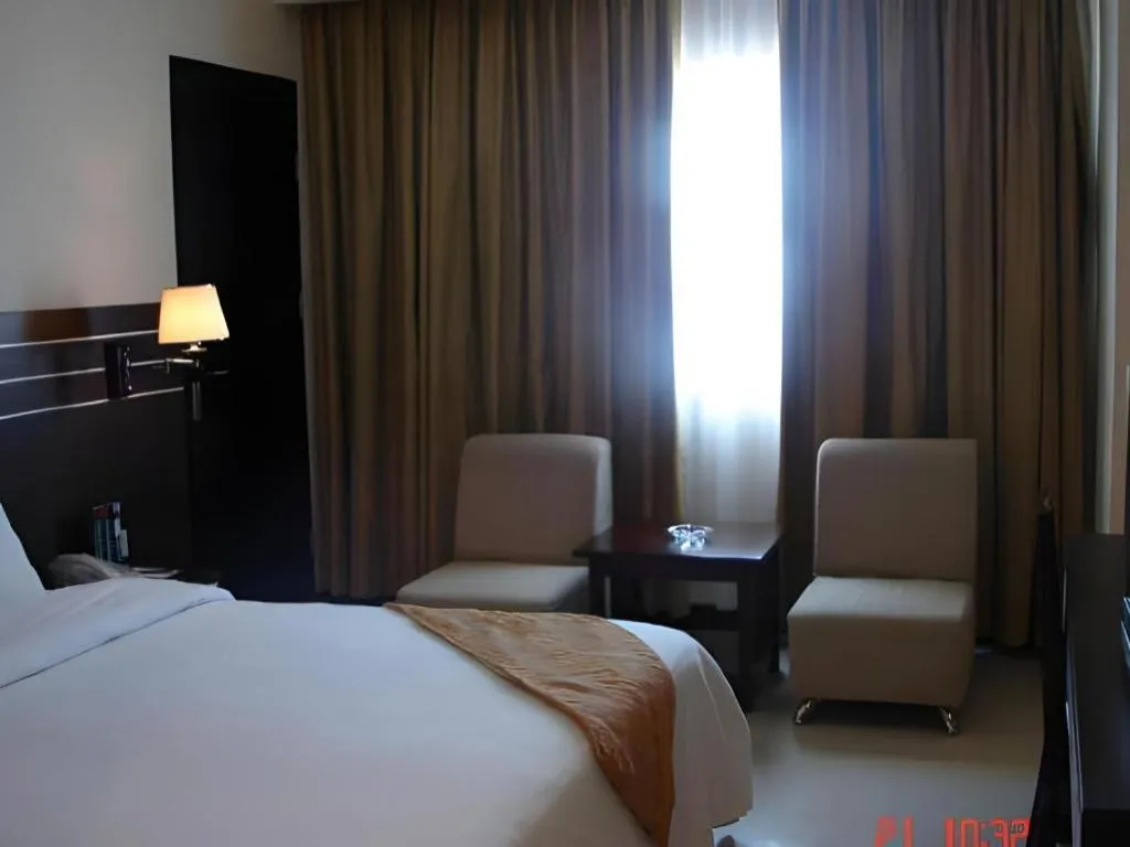 Bed in Grand Antares Hotel