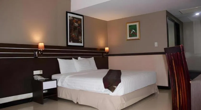 Bed in Grand Antares Hotel
