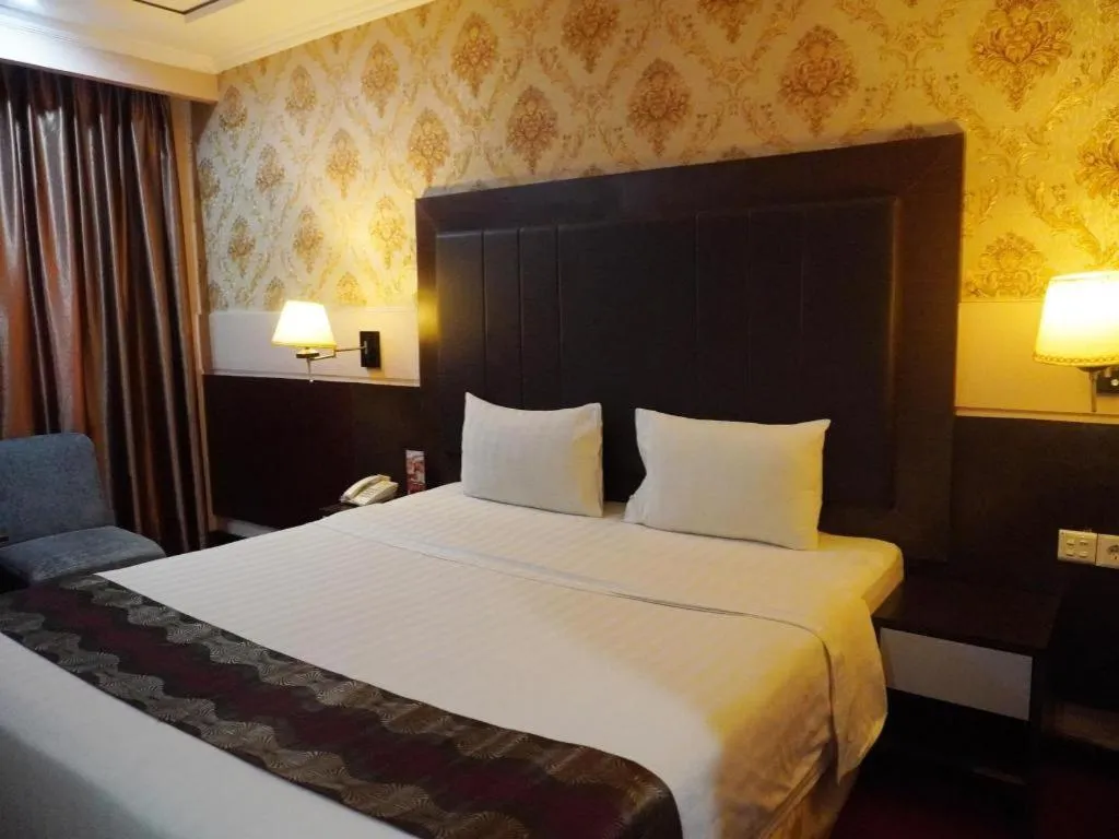 Bed in Grand Antares Hotel