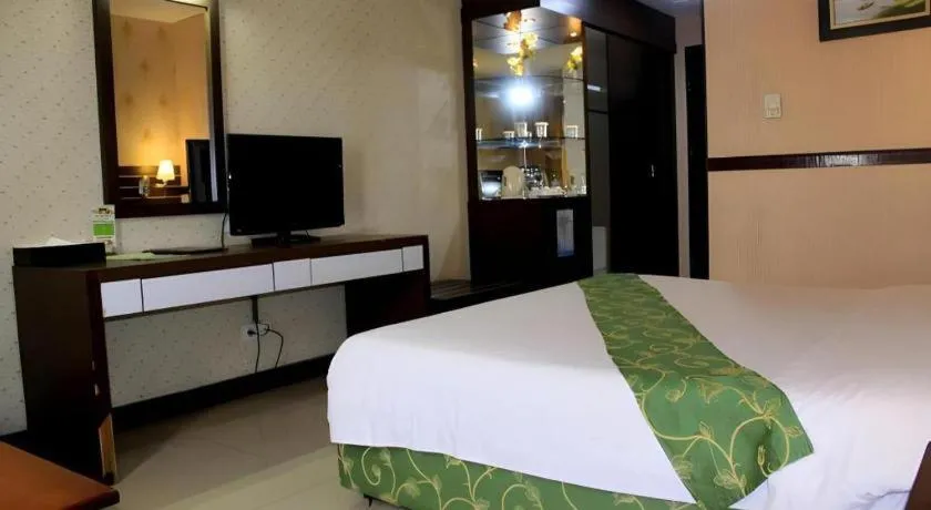 Bed in Grand Antares Hotel