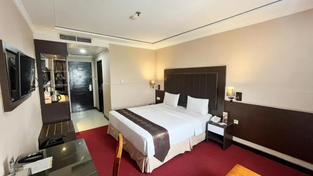 Bed in Grand Antares Hotel