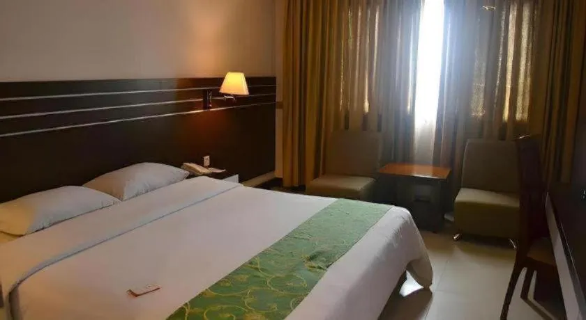 Bed in Grand Antares Hotel