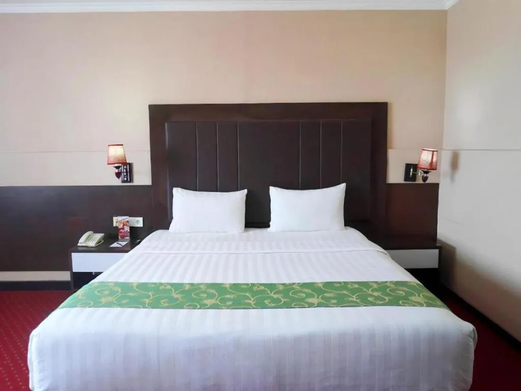 Bed in Grand Antares Hotel