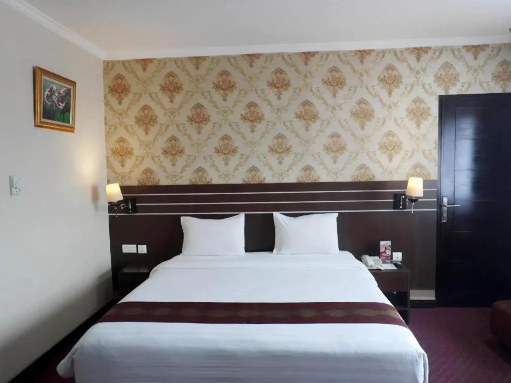 Bed in Grand Antares Hotel