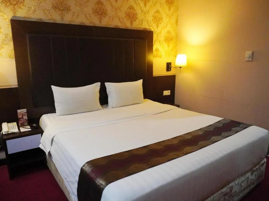Bed in Grand Antares Hotel