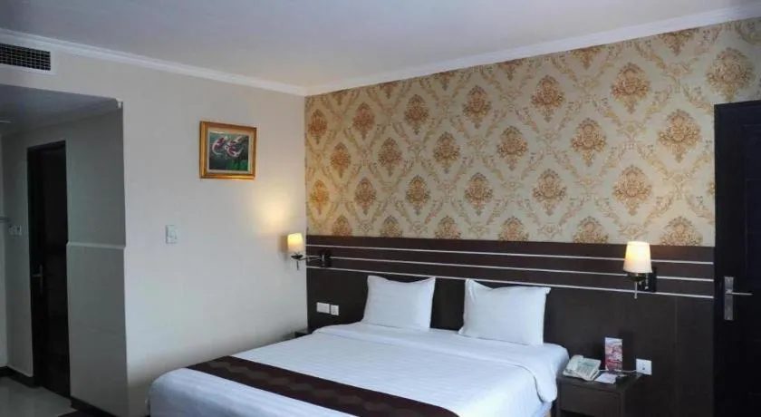 Bed in Grand Antares Hotel