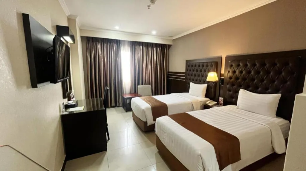 Bed in Grand Antares Hotel