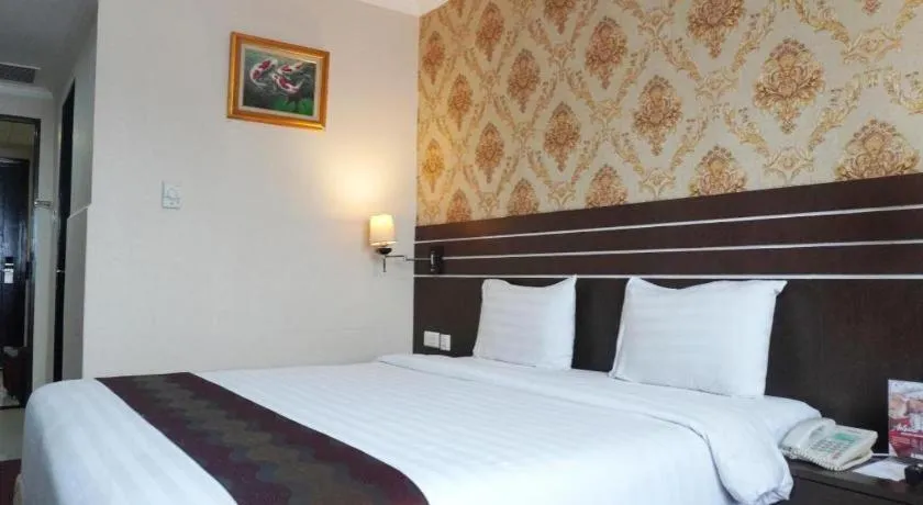 Bed in Grand Antares Hotel