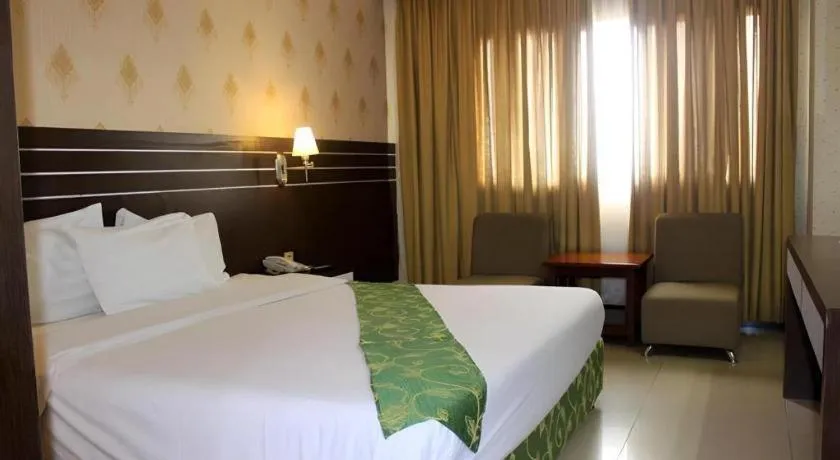 Bed in Grand Antares Hotel
