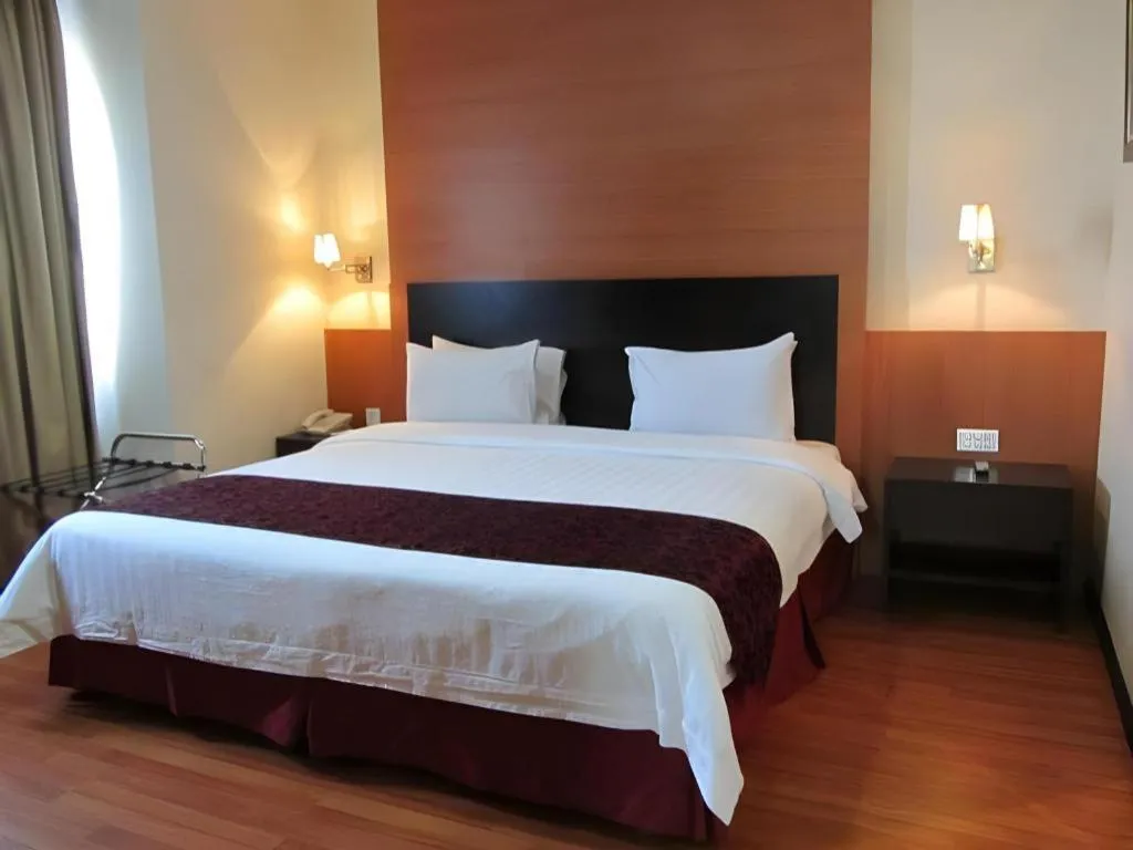 Bed in Grand Antares Hotel
