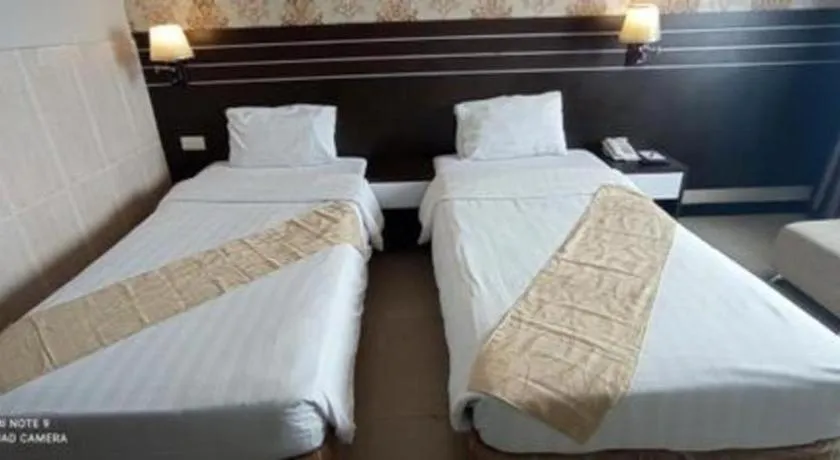 Bed in Grand Antares Hotel