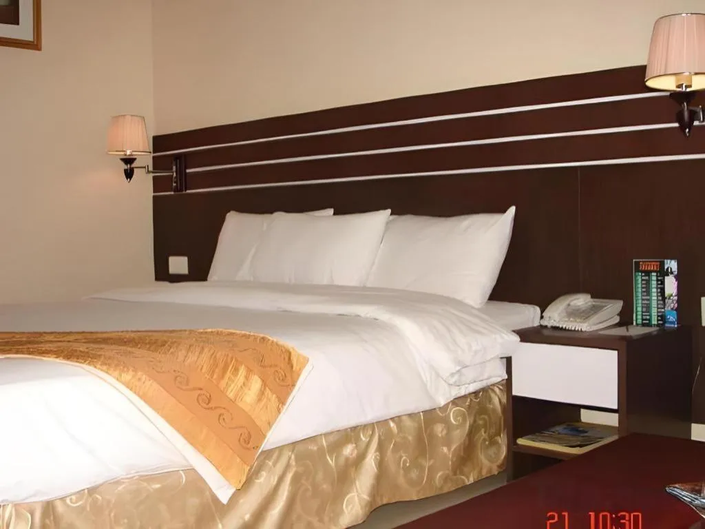 Bed in Grand Antares Hotel