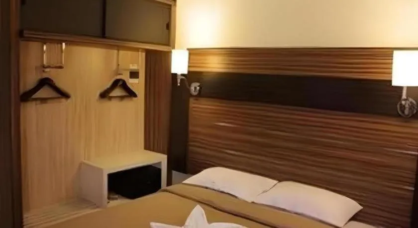 Bed in Travello Hotel Manado