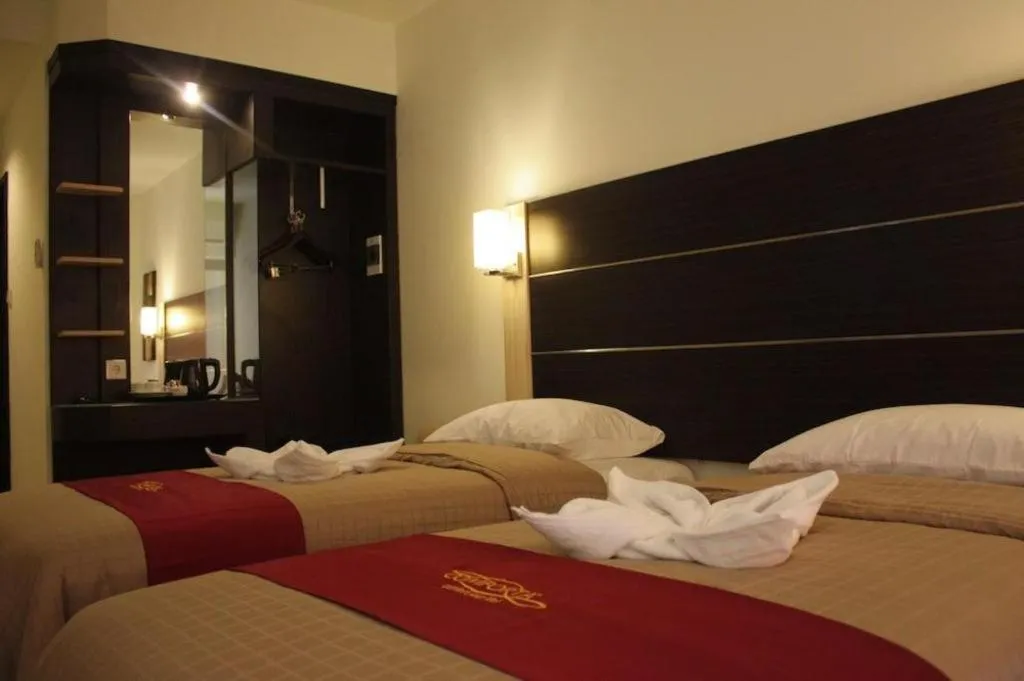Bed in Travello Hotel Manado