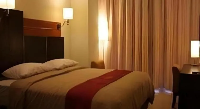 Bed in Travello Hotel Manado