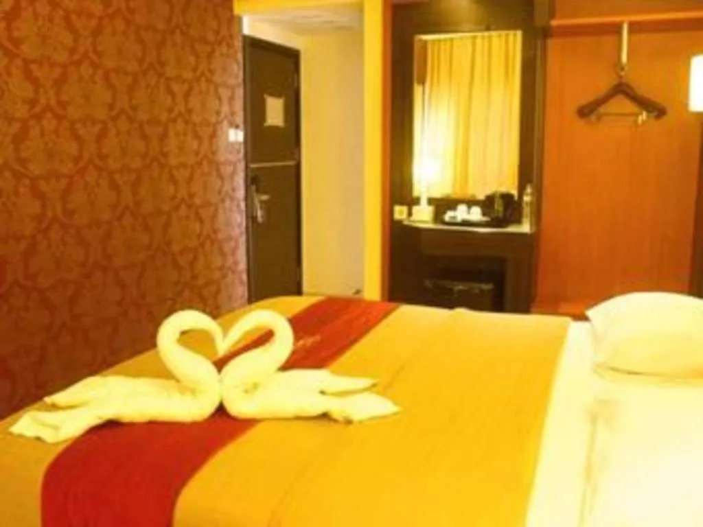Bed in Travello Hotel Manado