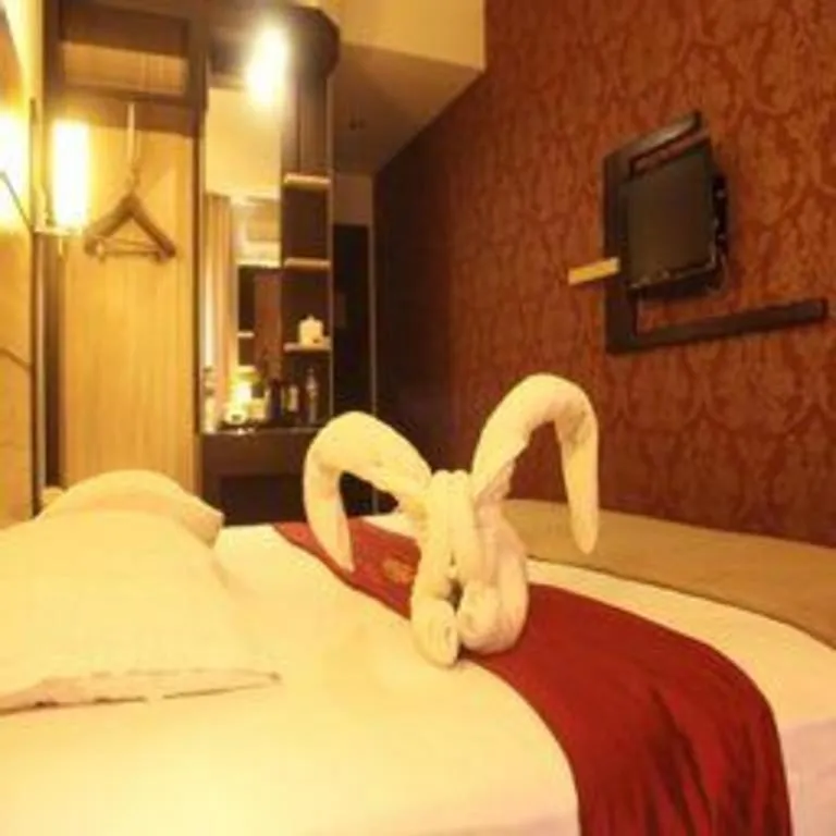 Bed in Travello Hotel Manado