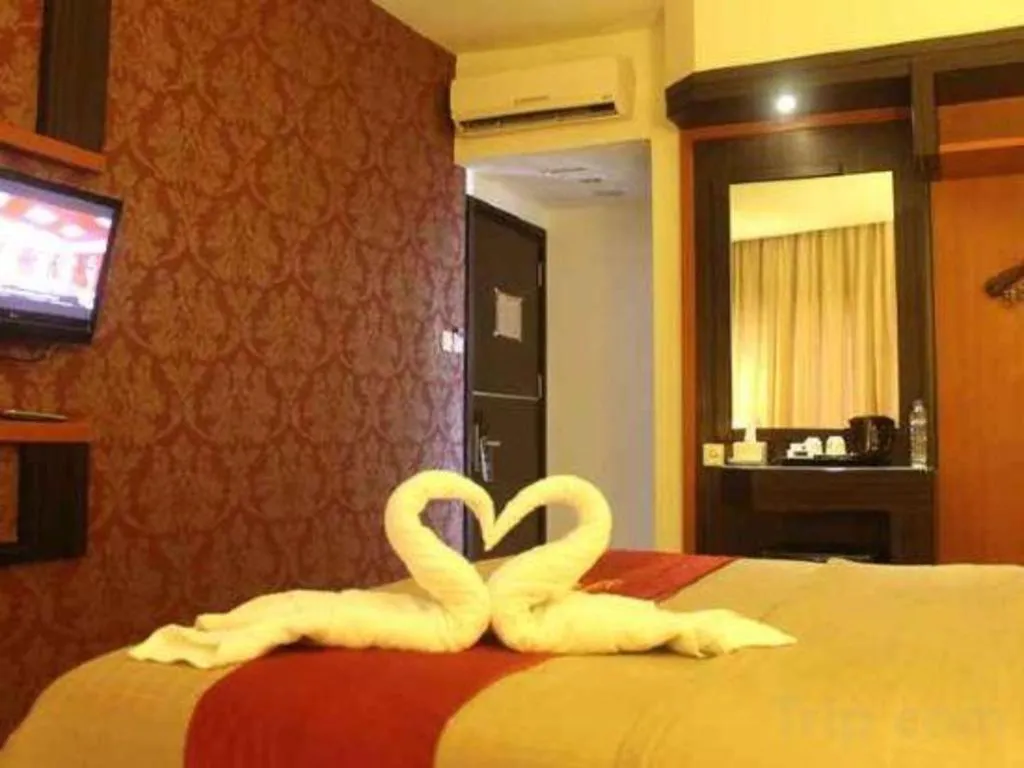 Bed in Travello Hotel Manado