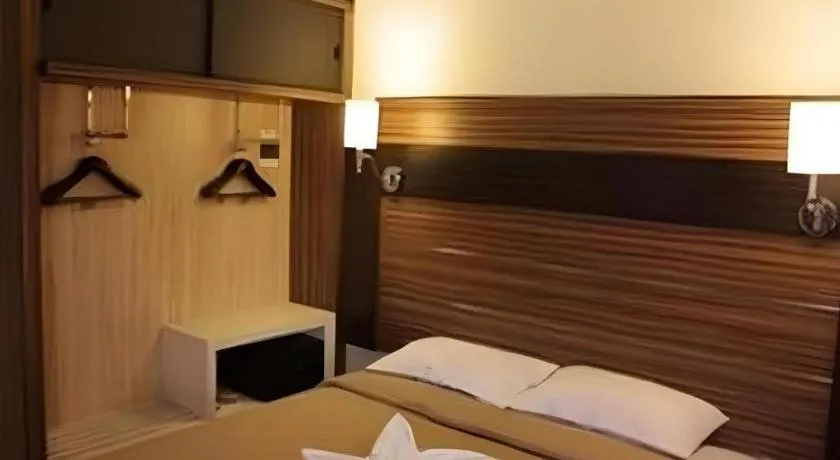 Bed in Travello Hotel Manado